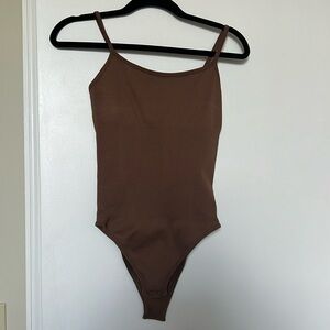 3 compression body suits - brown, black and white. Size S